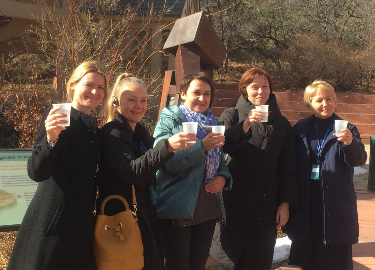 5 International Visitors tasting Manitou Springs spring water