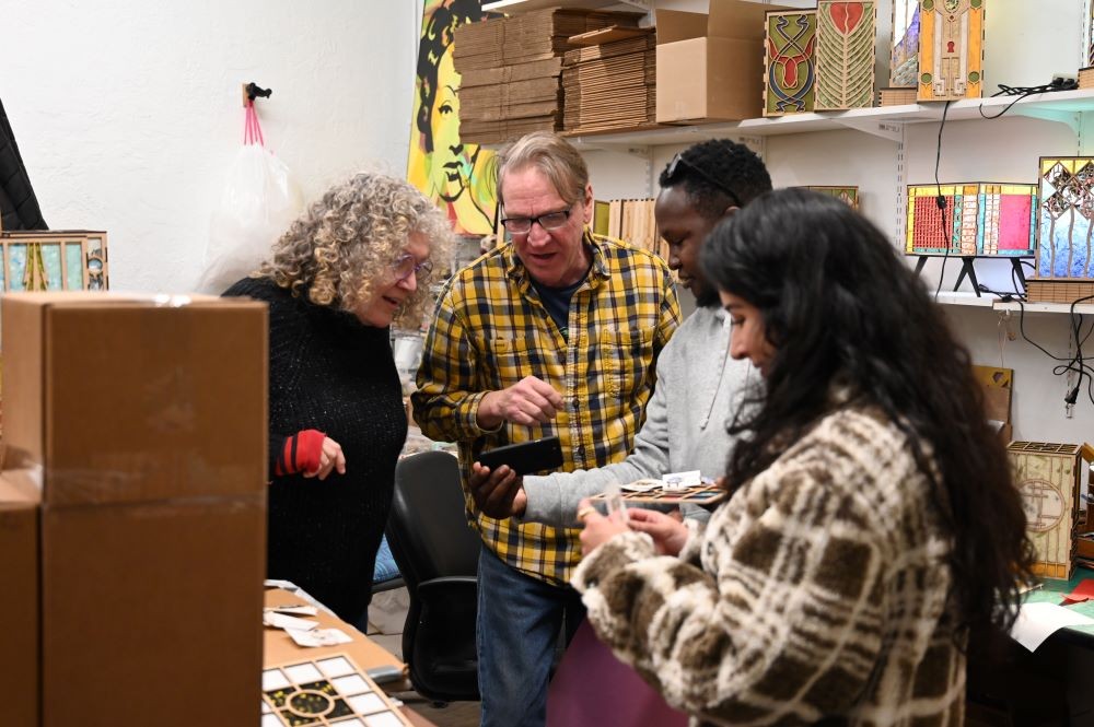 Artists at the Manitou Arts Center and international delegates exchange their artwork with each other.